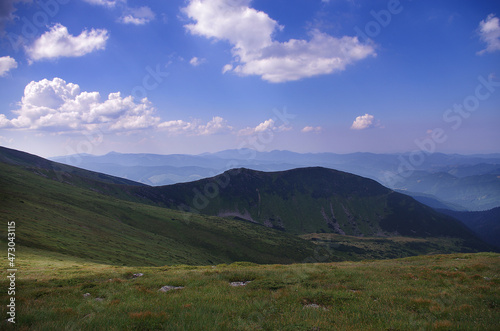 Mountain panoramic landscape with clouds and blue sky
