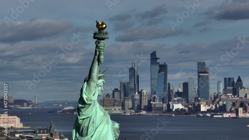 flying clockwise around Statue of Liberty with midtown NYC in background