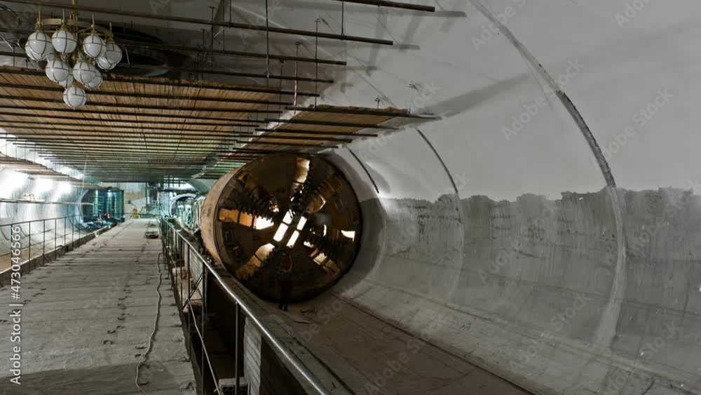 Tunnel boring machine moving across subway station under construction