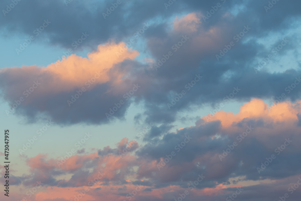 Blue sky with colorful clouds at sunset.