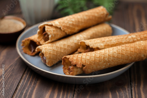Wafer rolls with condensed milk. Thin and Crispy Waffle. Selective focus