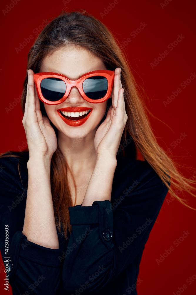 pretty woman wearing sunglasses fashion posing hairstyle red background pretty woman wearing sunglasses fashion posing hairstyle red background