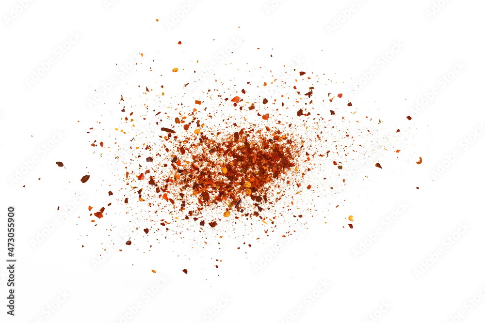 Red Hot Cayenne pepper isolated. Pile crushed red cayenne pepper, dried chili flakes and seeds isolated on white background