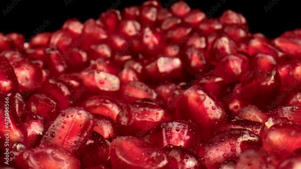 Dolly shot of Pomegranate Seeds. This macro shot shows rotating translucent red pomegranate seeds. Dolly shot of Pomegranate Seeds. This macro shot shows rotating translucent red pomegranate seeds.
