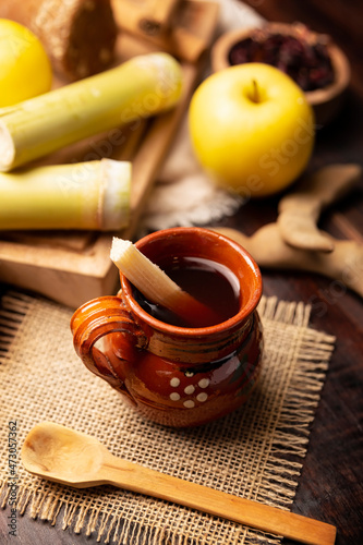 Ponche de Frutas. Christmas fruit punch is an infusion that is consumed in Mexico, traditionally during posadas and Christmas..Served in a clay cup called jarrito or cantarito photo