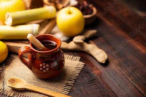 Ponche de Frutas. Christmas fruit punch is an infusion that is consumed in Mexico, traditionally during posadas and Christmas..Served in a clay cup called jarrito or cantarito photo