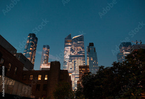 Night view on the centre of a city illuminated with numerous lights. 
