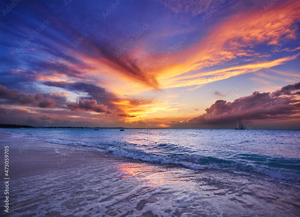 Clouds lit up by sunset. Grace Bay Beach (at Park on Princess Drive),  Providenciales, Turks and Caicos Islands Stock Photo | Adobe Stock