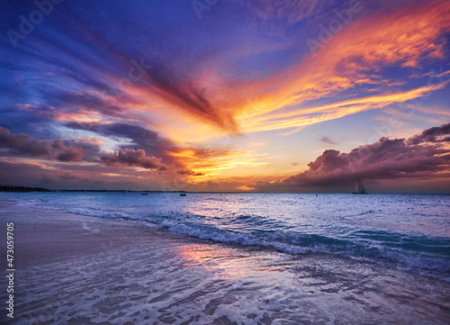 Clouds lit up by sunset. Grace Bay Beach (at Park on Princess Drive), Providenciales, Turks and Caicos Islands