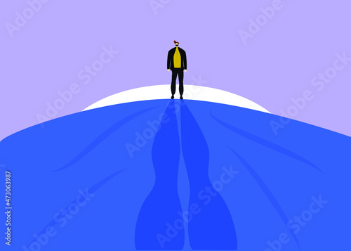 Man walking in nature the moon behind him and his shadow stretches along the road. Concept of strong people who continue their hard-working path. human psychology and mood.