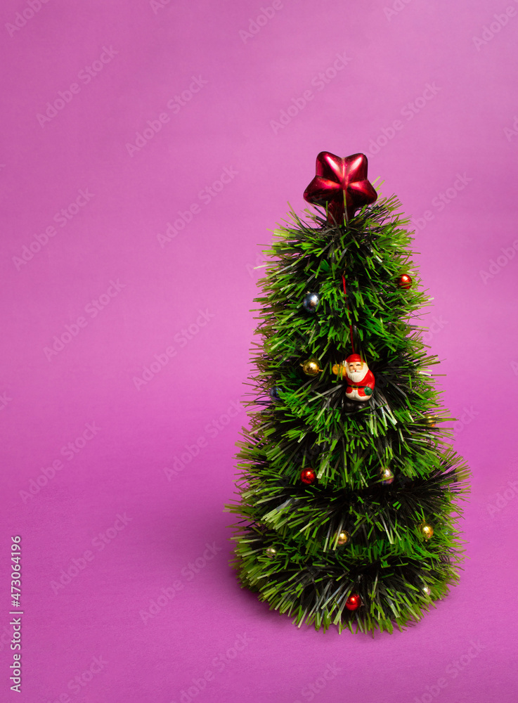 Christmas tree with Santa Claus on a purple background. Velvet violet minimal concept. Christmas tree with Santa Claus on a purple background. Velvet violet minimal concept.