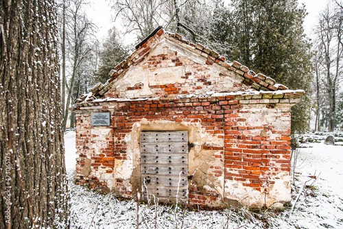 An old, historic, abandoned red brick chapel with a cellar, Barbele, Latvia photo