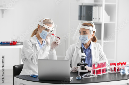 Scientists working with sam...