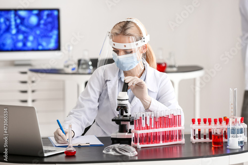 Scientist studying sample i...
