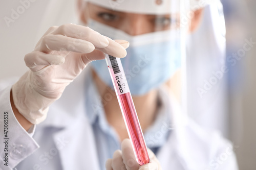 Scientist with sample of co...
