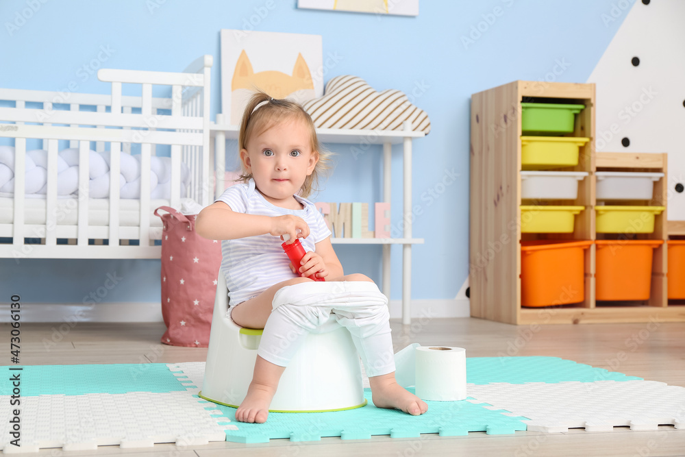 Cute baby girl sitting on potty at home Stock Photo Adobe Stock