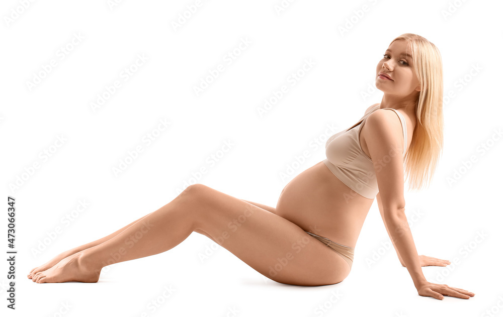 Obraz premium Beautiful pregnant woman on white background