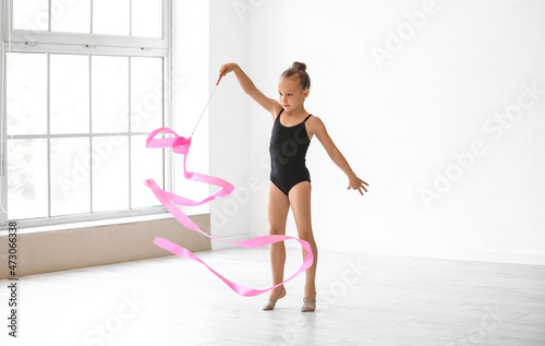 Little girl doing gymnastic...