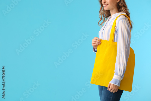 Pretty young woman with yel...