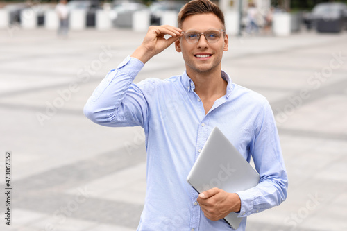 Handsome young man in eyegl...