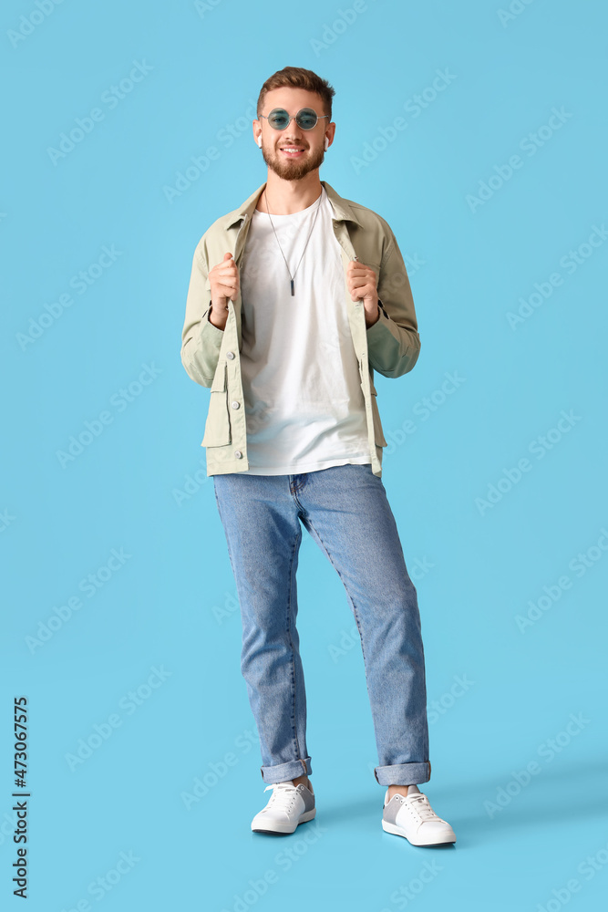 Stylish young man in jacket on blue background Stylish young man in jacket on blue background