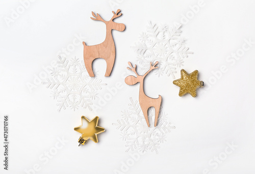 Beautiful figures of deer  snowflakes and stars on white background
