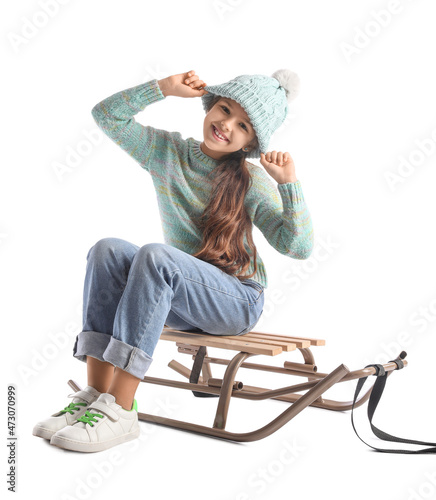 Little girl with sled on wh...