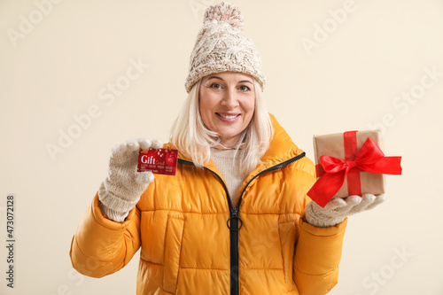 Mature woman with gift card...