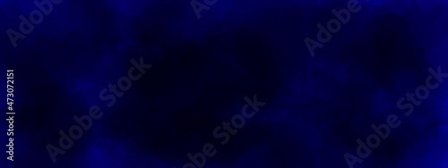 Abstract blue holiday background. Blue backdrop grunge background texture for banner. Abstract blue dust explosion on black background. Freeze motion of blue powder splash.