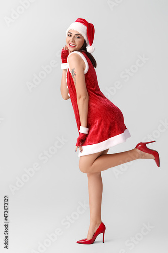 Sexy young woman in Santa c...