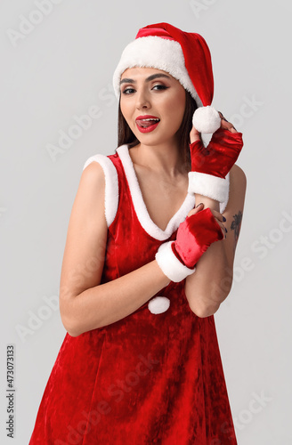 Sexy young woman in Santa c...