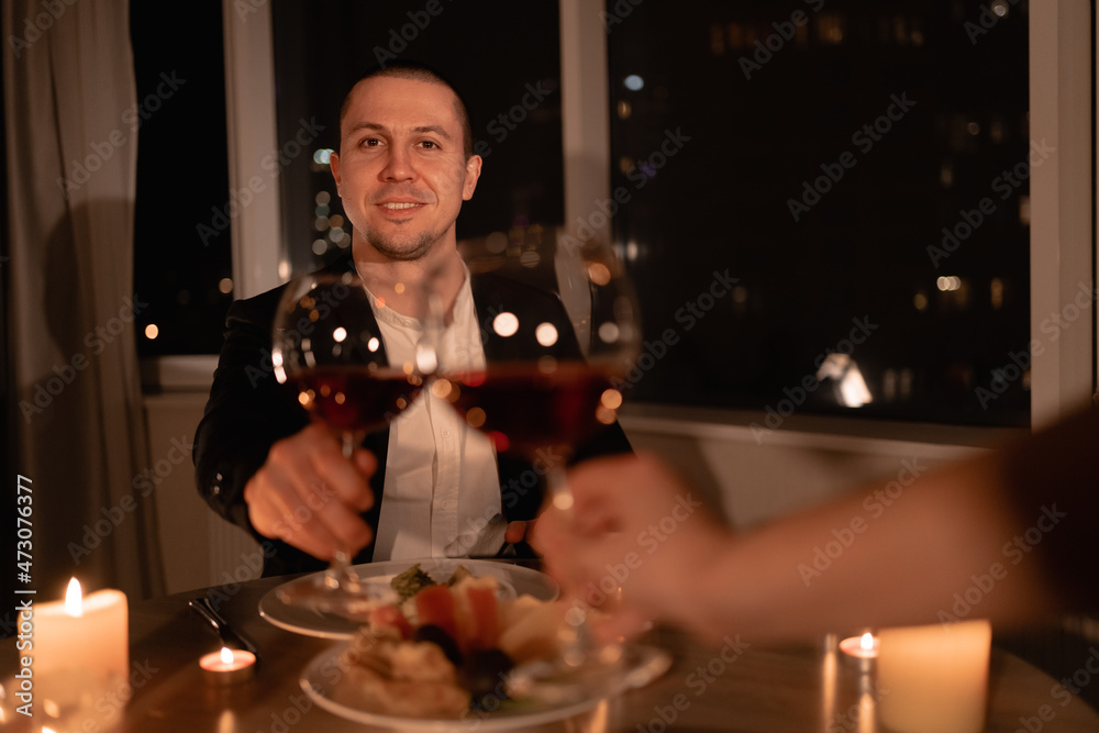 dinner valentines day, couple hands with glass of wine, evening of love at home together, date after work, wedding anniversary dine with alcohol