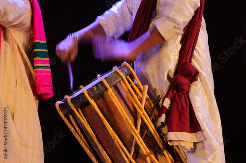 Close up of hand playing Indian musical instrument