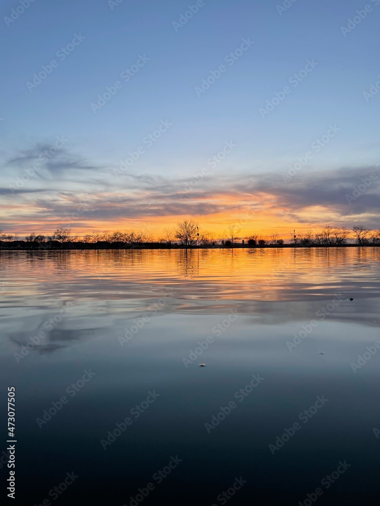 Fototapeta premium sunset over the river