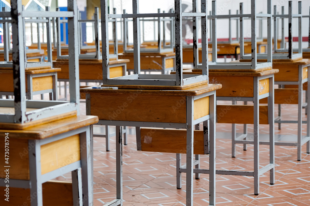 Desk and chairs in classroom at school Desk and chairs in classroom at school