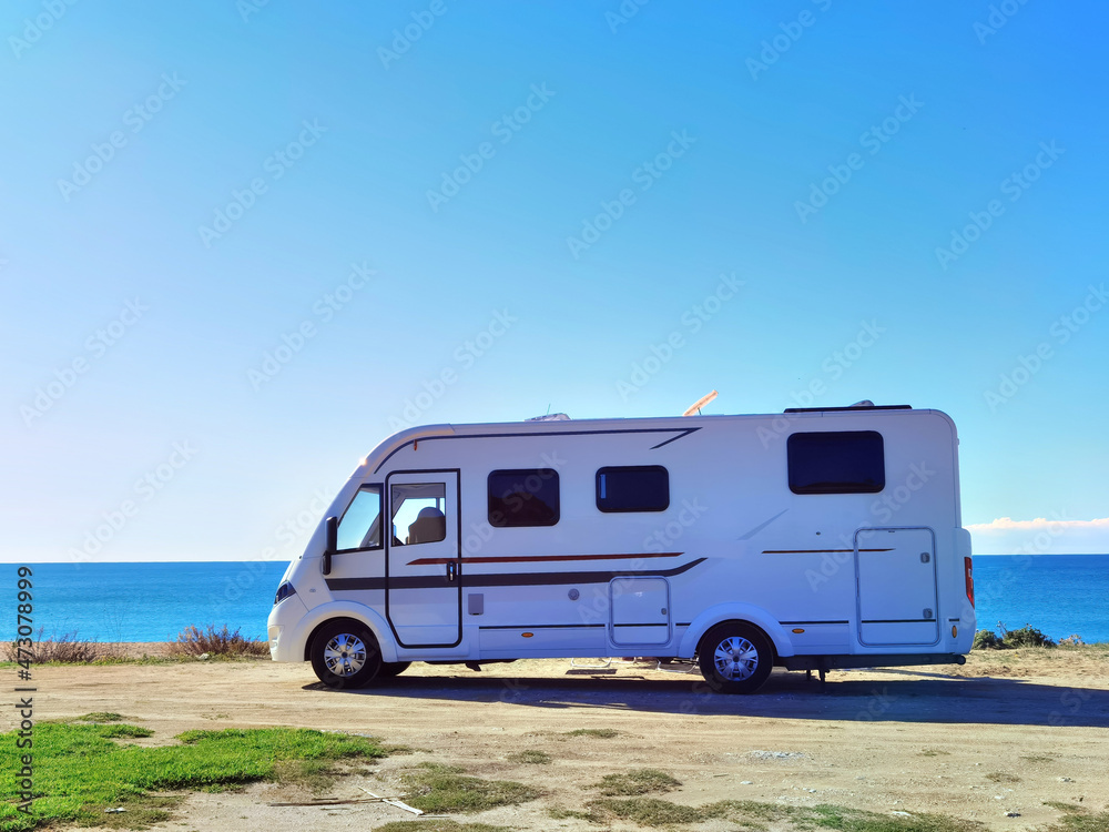 caravan car by the beach in autumn season sunny day