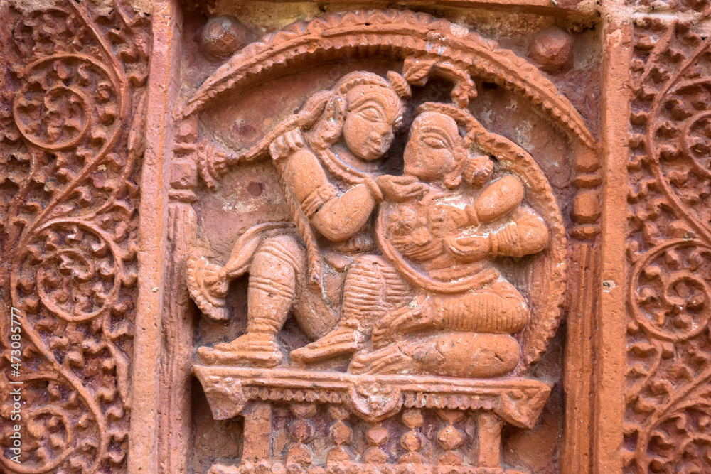 Terracotta Temple Wall : Beautiful terracotta carving scenes of Ramayana and Mahavarat on the walls of ancient Hindu Terracotta Temple at Guptipara Brindaban Chandra's Math, India.