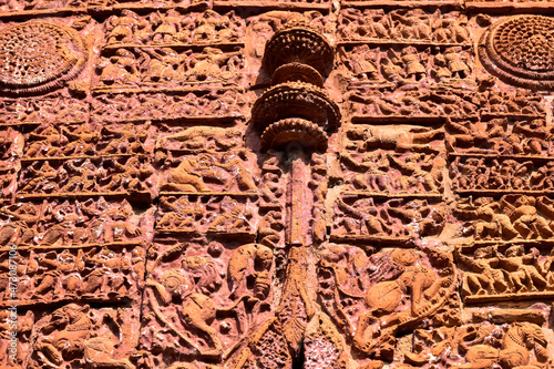 Terracotta Temple Wall : Beautiful terracotta carving scenes of Ramayana and Mahavarat on the walls of ancient Hindu Terracotta Temple at Guptipara Brindaban Chandra's Math, India. photo