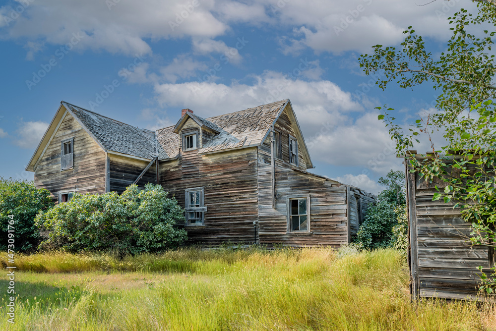 Abandoned home and outhouse on the prairies in Saskatchewan, Canada Abandoned home and outhouse on the prairies in Saskatchewan, Canada
