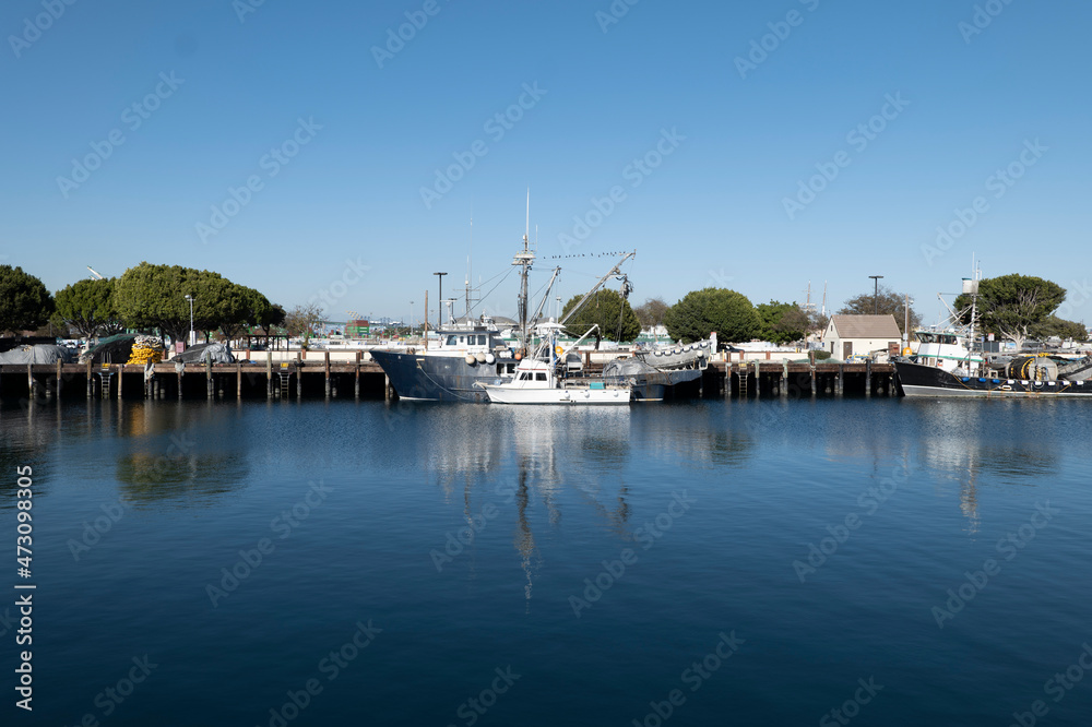Boats docked at a commercial fishing harbor