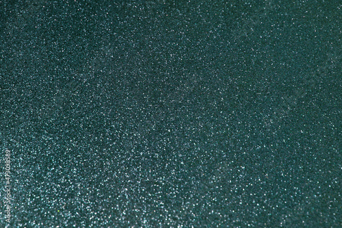 Shiny dark green abstract glitter background for holiday design. Stock photography. 