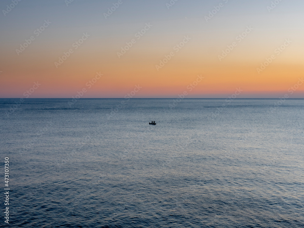 A fisherman boat on the mediterranean sea in front of Manarola in the Cinque Terre