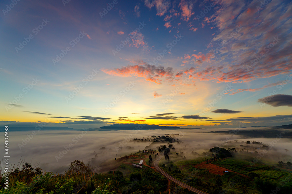Fototapeta premium Beautiful scenery views mist in the mountain at sunrise. Morning mist sunrise at Khao Takhian Ngo views point, Khao Kho, Phetchabon, Thailand