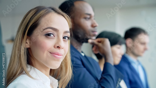 Hispanic woman in the office. Global business. Teamwork of business.