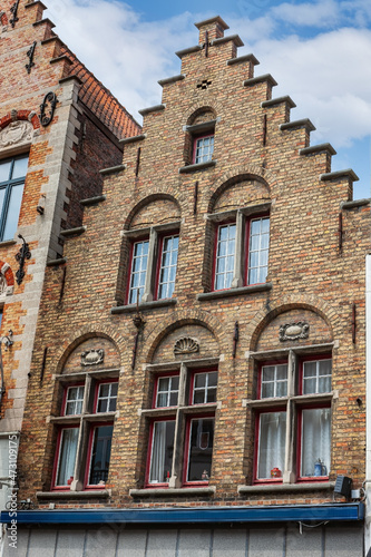 Traditional colorful Belgian house facades in Bruges. © Sergey