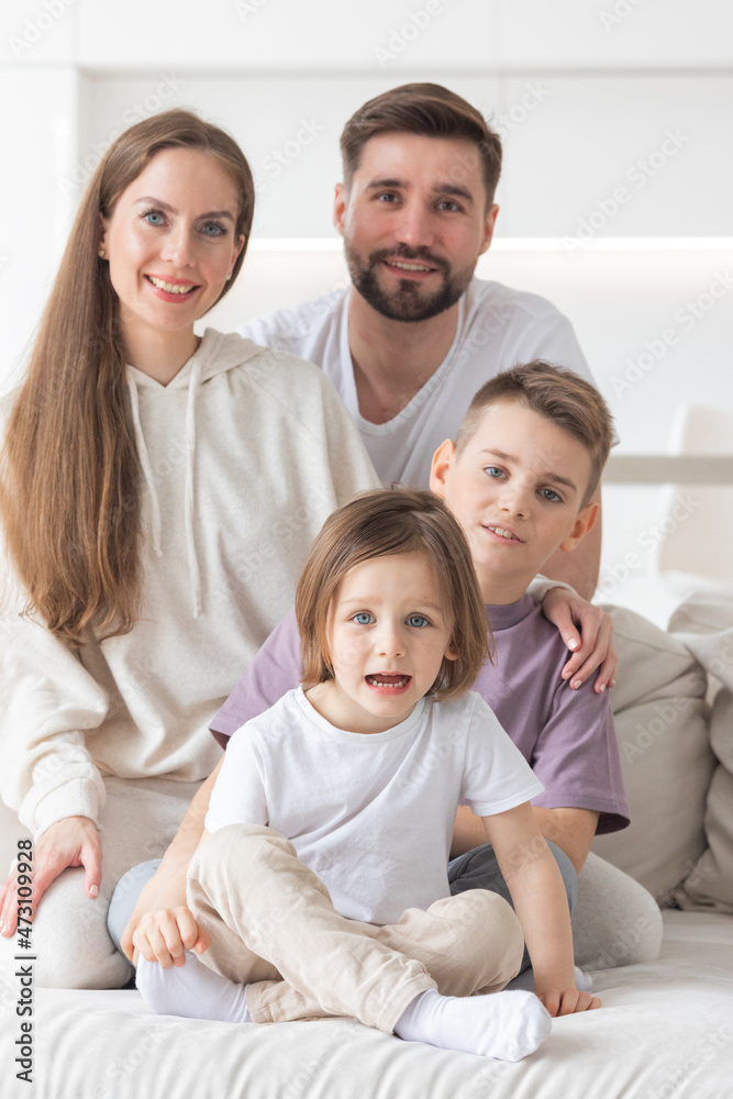 Portrait of a happy family smiling at home