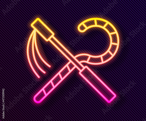 Glowing neon line Crook and flail icon isolated on black background. Ancient Egypt symbol. Scepters of egypt. Vector
