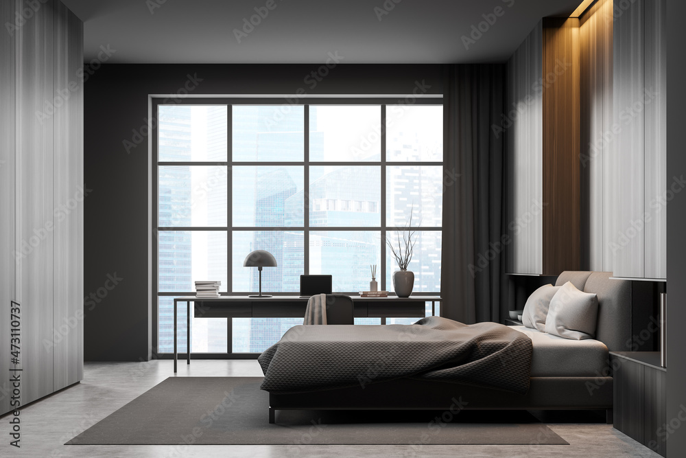 Dark bedroom interior with bed on concrete floor, window and workplace Dark bedroom interior with bed on concrete floor, window and workplace