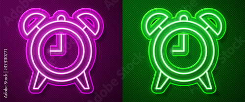 Glowing neon line Alarm clock icon isolated on purple and green background. Wake up, get up concept. Time sign. Vector
