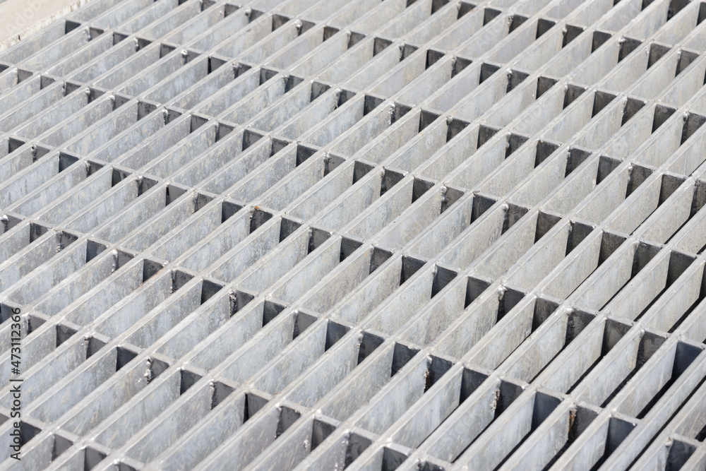steel grating background and texture. tiled metal ground grid. steel grating background and texture. tiled metal ground grid.